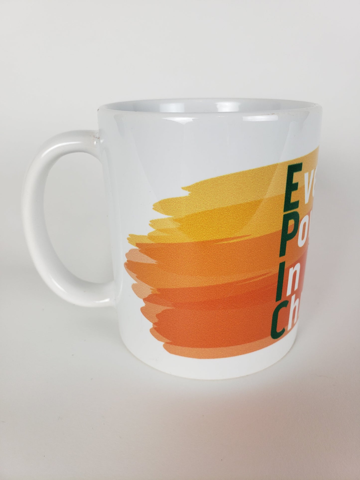 Ever Powerful In Christ Coffee Mug – Orange and Green